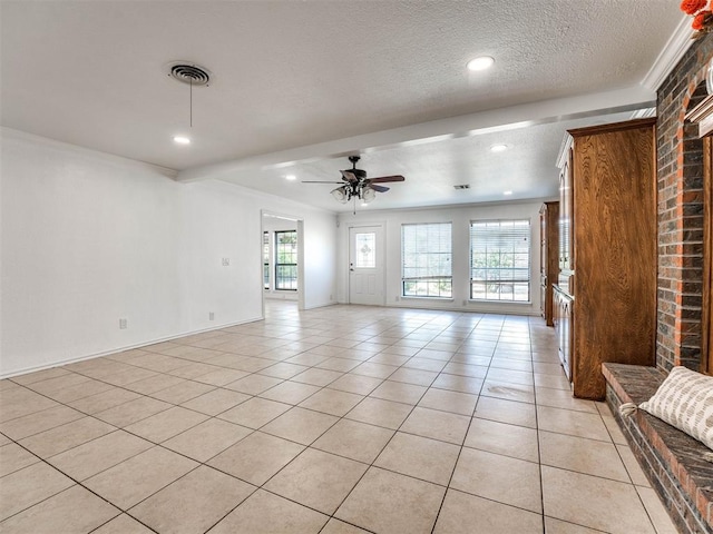 unfurnished living room with ceiling fan, crown molding, light tile patterned floors, and a textured ceiling