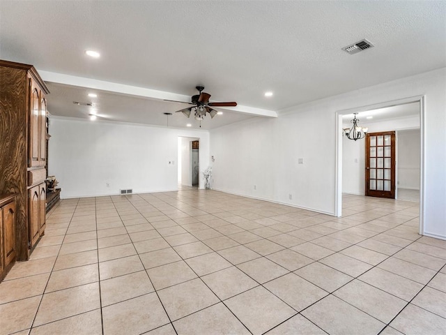 unfurnished room featuring ceiling fan with notable chandelier and light tile patterned flooring