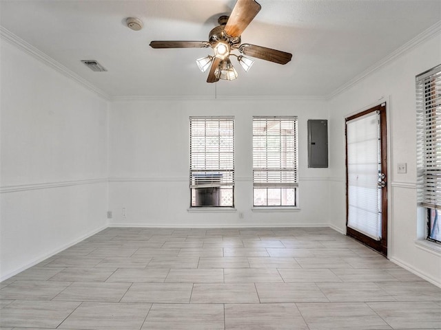 empty room with electric panel, ceiling fan, and crown molding