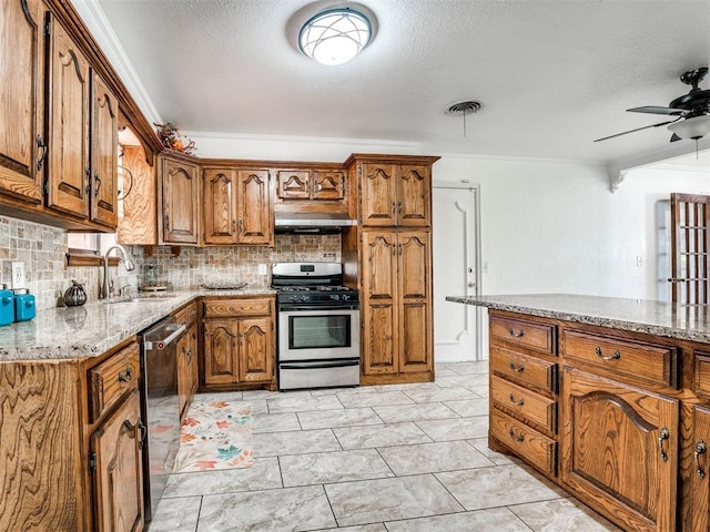 kitchen featuring sink, backsplash, crown molding, extractor fan, and appliances with stainless steel finishes