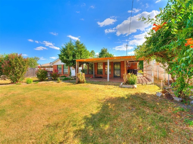 rear view of house with a lawn