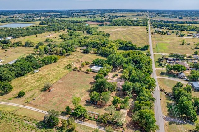 drone / aerial view featuring a rural view and a water view