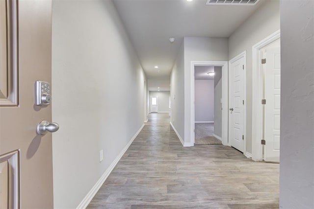 hallway featuring light hardwood / wood-style floors