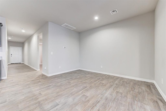 unfurnished room featuring light hardwood / wood-style flooring