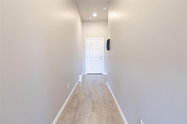 corridor featuring light hardwood / wood-style floors