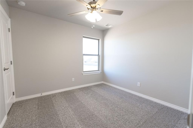 carpeted empty room with ceiling fan