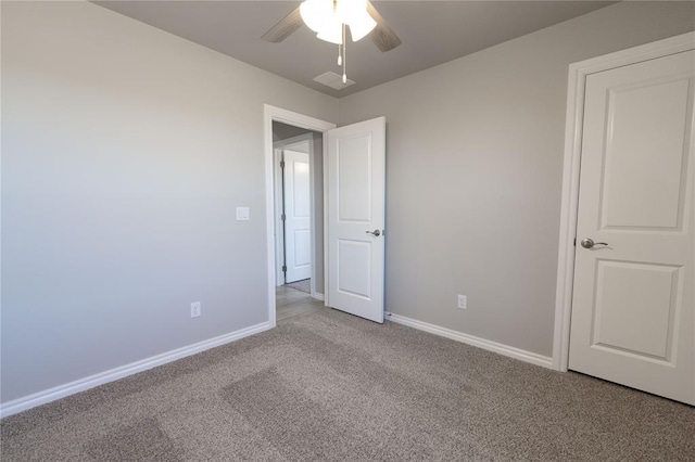 unfurnished bedroom featuring light carpet and ceiling fan