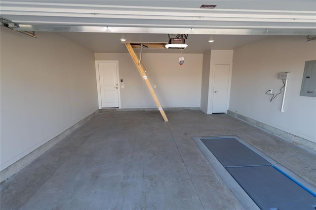 garage featuring a garage door opener and electric panel