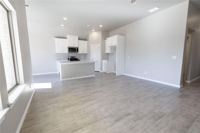 unfurnished living room with light hardwood / wood-style flooring