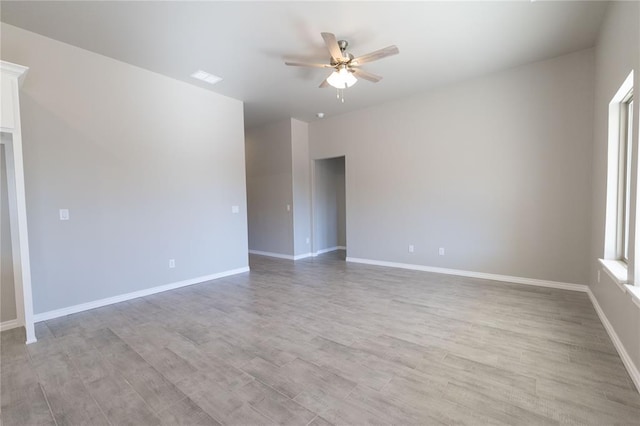 unfurnished room with ceiling fan and light hardwood / wood-style flooring