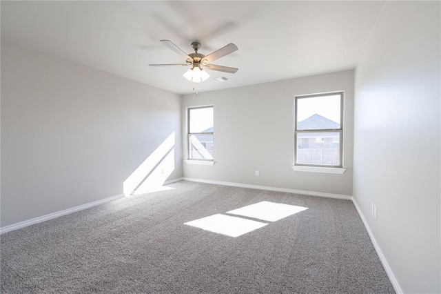 carpeted empty room with ceiling fan