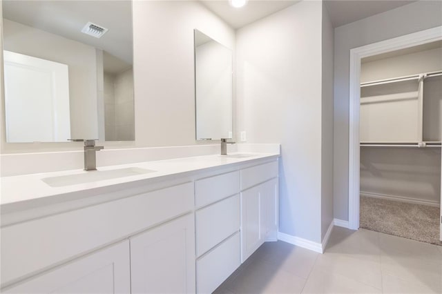 bathroom with vanity and tile patterned floors