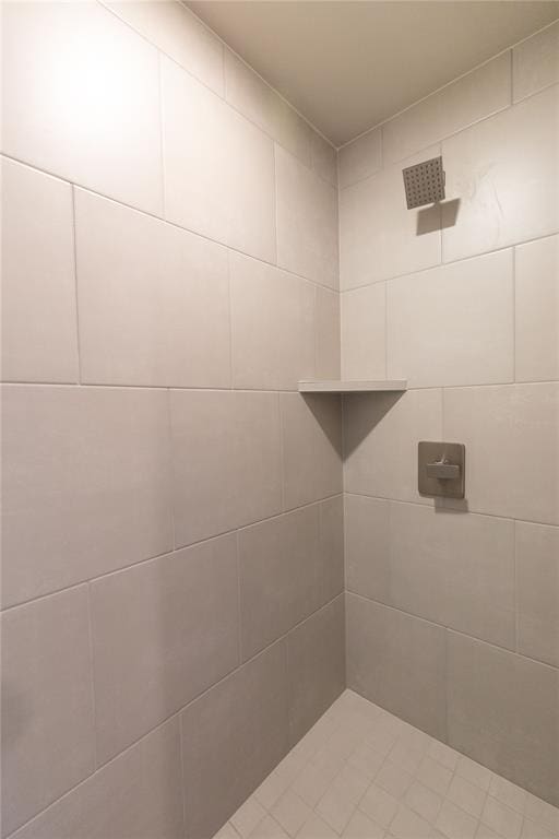 bathroom with a tile shower