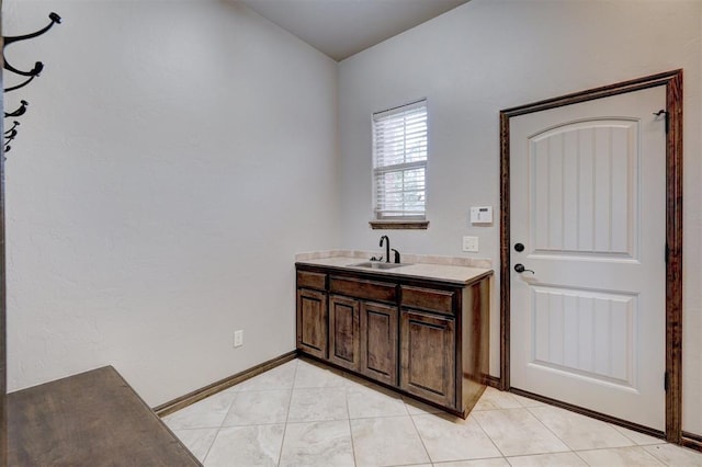 bathroom with tile patterned flooring and vanity