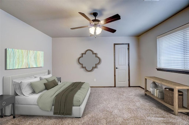 bedroom featuring ceiling fan and light carpet