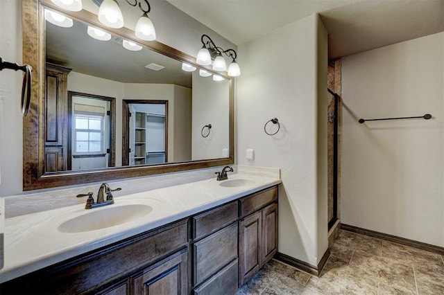 bathroom with vanity and an enclosed shower