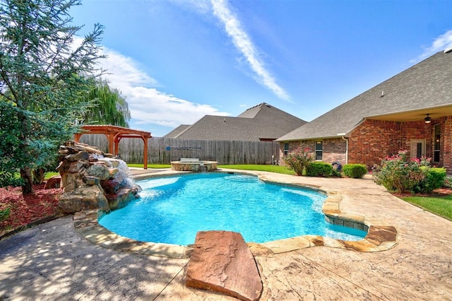 view of swimming pool with pool water feature and a patio