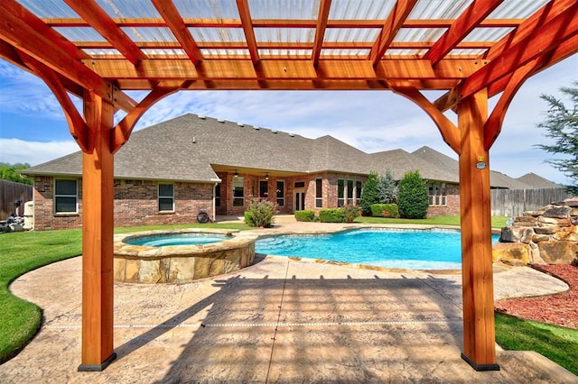 view of pool featuring a patio area, a pergola, and an in ground hot tub