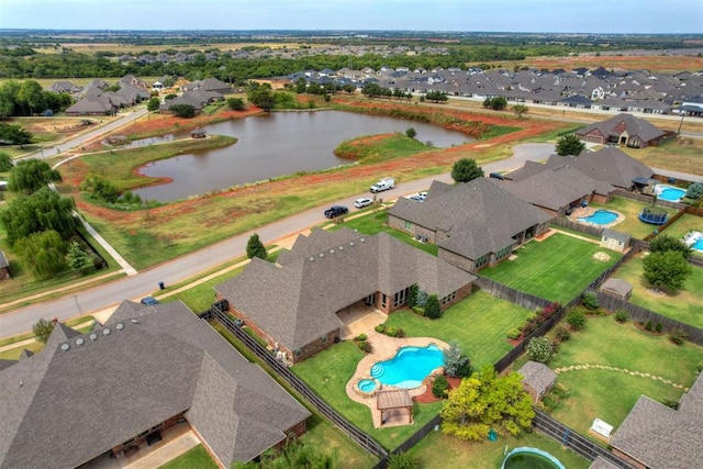 drone / aerial view with a water view