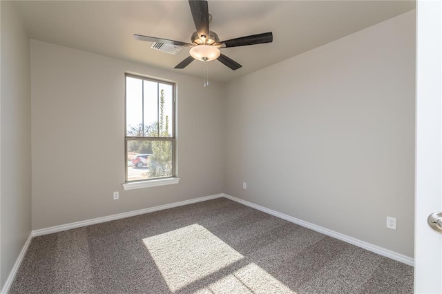 carpeted empty room featuring ceiling fan