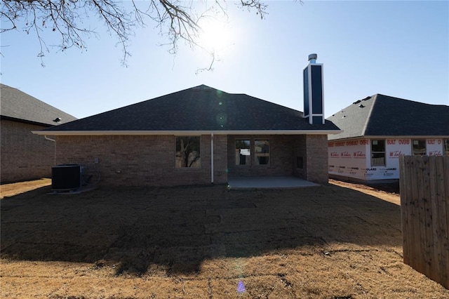 back of property with a patio area and central AC unit