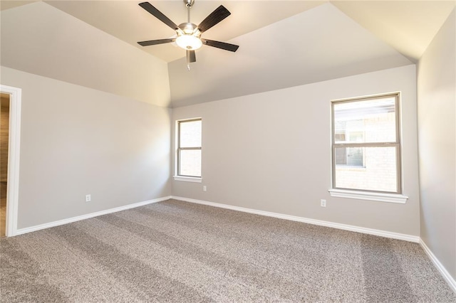 spare room featuring carpet, ceiling fan, and lofted ceiling