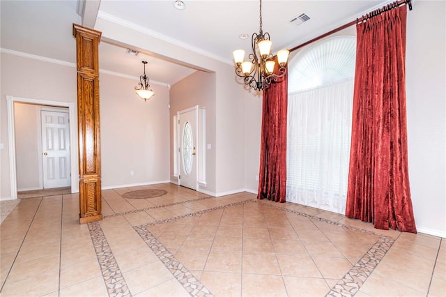 empty room featuring crown molding, light tile patterned floors, and an inviting chandelier