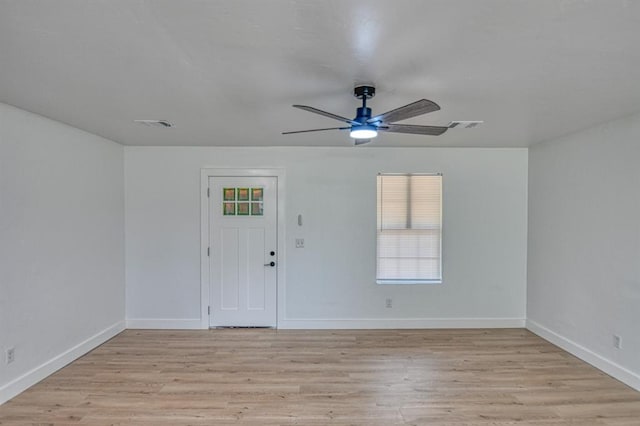 unfurnished room with ceiling fan and light hardwood / wood-style floors