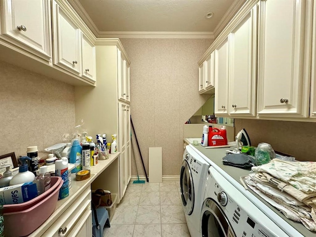 laundry area with separate washer and dryer, crown molding, and cabinets