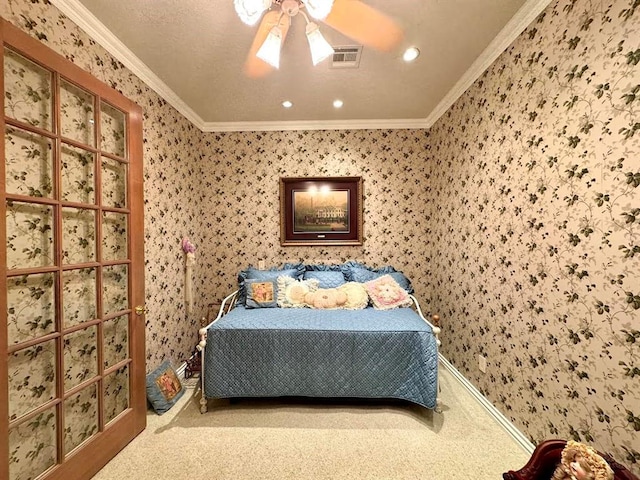 bedroom with carpet flooring, ceiling fan, and ornamental molding