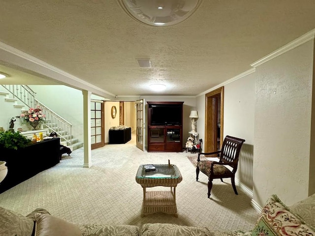 living room featuring carpet flooring, a textured ceiling, and ornamental molding