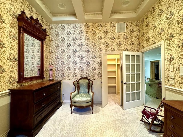 living area featuring beam ceiling, light colored carpet, crown molding, and coffered ceiling