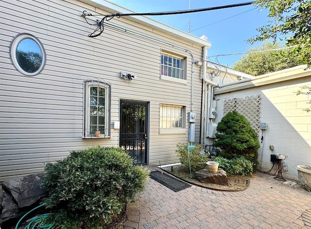 entrance to property featuring a patio area