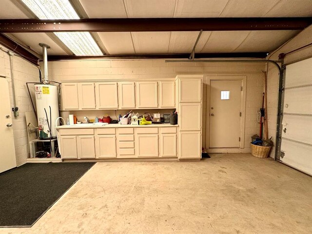 garage with sink and gas water heater