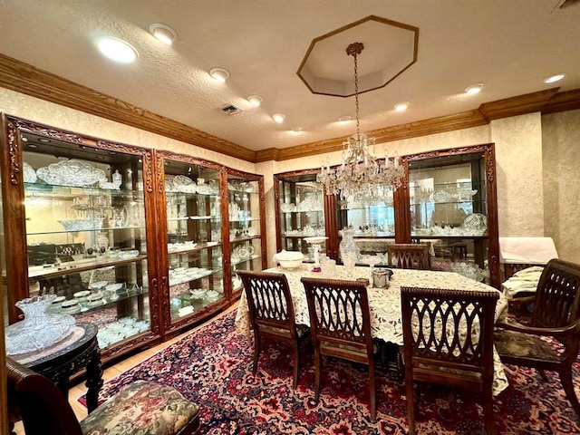 dining space with a notable chandelier and crown molding