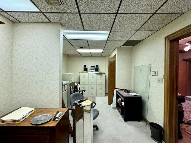 office with a paneled ceiling