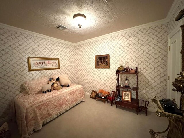 bedroom featuring carpet flooring, a textured ceiling, and ornamental molding