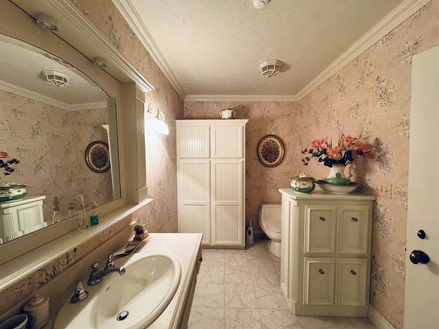 bathroom featuring toilet, vanity, and ornamental molding