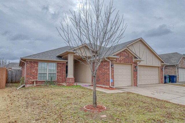 single story home featuring a garage and a front lawn