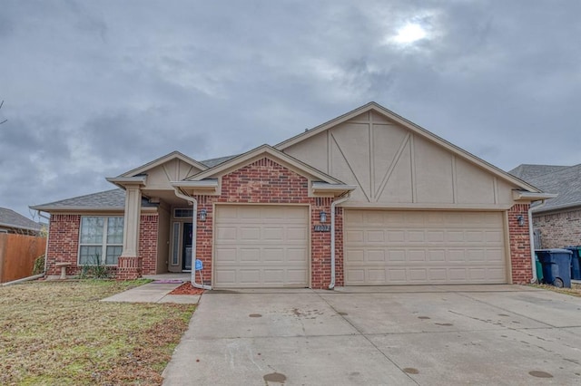 view of front of property featuring a garage and a front lawn