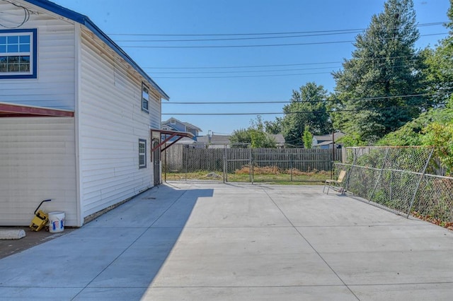 view of patio / terrace with basketball hoop