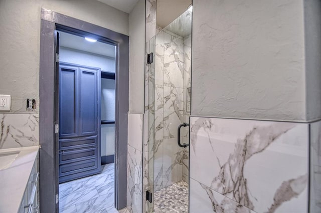 bathroom with vanity and walk in shower