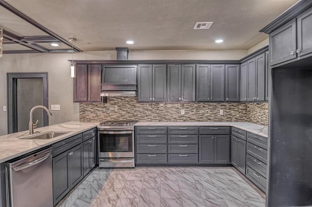 kitchen with appliances with stainless steel finishes, tasteful backsplash, gray cabinetry, and sink