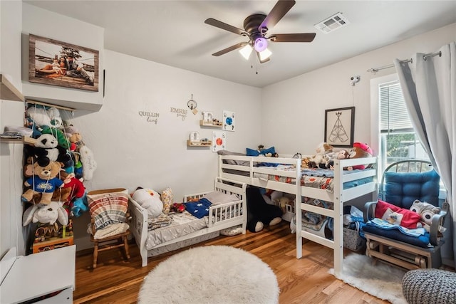 bedroom featuring ceiling fan and hardwood / wood-style floors