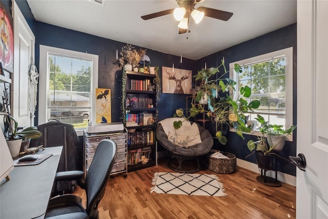 office space featuring light hardwood / wood-style floors, plenty of natural light, and ceiling fan