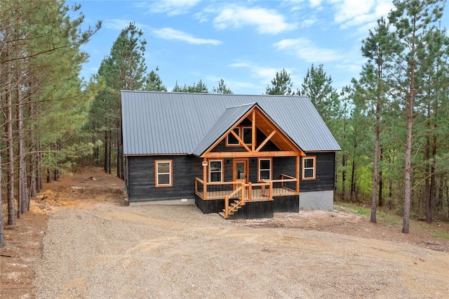 log cabin with covered porch