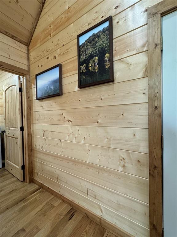 room details with wood walls and wood-type flooring