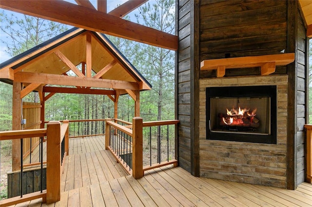 deck with an outdoor fireplace