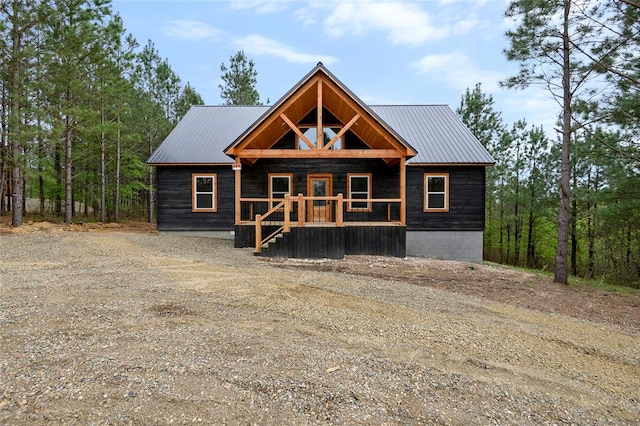 log home with covered porch