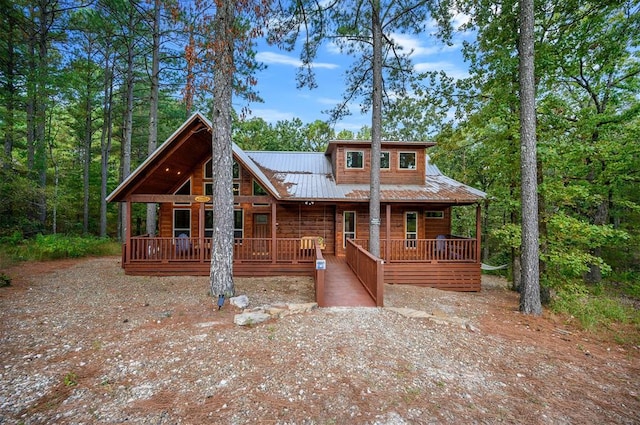 log cabin featuring a porch